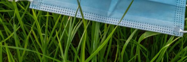 Medical,Mask,In,Fresh,,Green,Spring,Grass.,Concept,Of,Face